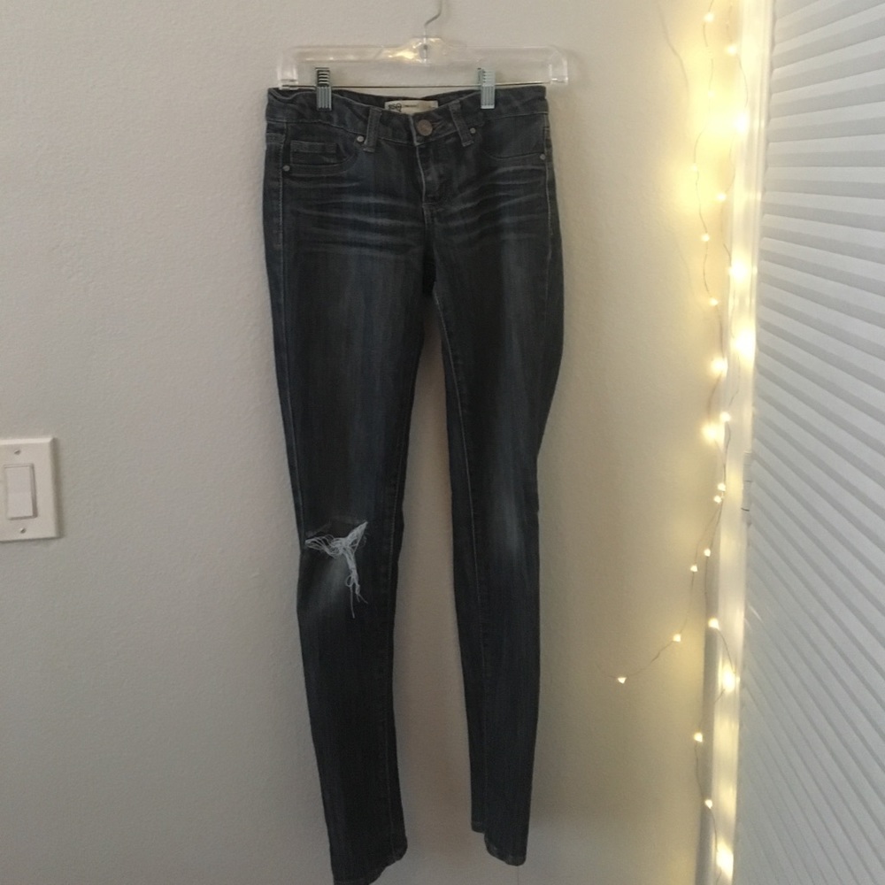 Ripped dark blue jeans